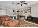 Home office featuring a desk, seating area, and ceiling fan at 1510 Mahogany Ln # 606, Palm Harbor, FL 34683