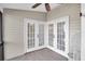 Spacious screened porch with double French doors at 1510 Mahogany Ln # 606, Palm Harbor, FL 34683