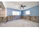 Under-renovation bedroom with light blue walls and exposed framing at 4561 Shore Acres Ne Blvd, St Petersburg, FL 33703