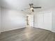 Bright bedroom with ceiling fan and wood-look flooring at 1548 Illinois Ave, Palm Harbor, FL 34683