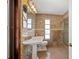 Bathroom features granite tile and a double vanity at 1713 Grand Central Dr, Tarpon Springs, FL 34689