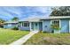 Charming light blue house with green door at 1714 58Th S St, Gulfport, FL 33707