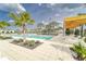 Relaxing community pool with lounge chairs and shaded areas at 31451 Moniker Mast Ln, San Antonio, FL 33576