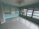 Bright sunroom with water views and tile floors at 348 Bahia Vista Dr, Indian Rocks Beach, FL 33785