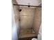 Updated bathroom with a tiled shower at 8823 W Robson St, Tampa, FL 33615
