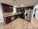 Kitchen boasts granite countertops and stainless steel appliances at 8823 W Robson St, Tampa, FL 33615