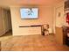 Living room with mounted TV and ample floor space at 8823 W Robson St, Tampa, FL 33615