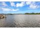 Expansive waterfront view of calm waters on a bright and sunny day with puffy clouds at 945 Bayshore Dr, Tarpon Springs, FL 34689