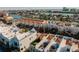 Aerial view showing a townhouse community near the water, highlighting private rooftop space at 140 Brightwater Dr # 6, Clearwater Beach, FL 33767