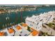 Aerial view of waterfront property with private boat dock and rooftop terrace at 140 Brightwater Dr # 6, Clearwater Beach, FL 33767