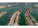 Aerial view showcasing the property's waterfront location and private boat dock at 140 Brightwater Dr # 6, Clearwater Beach, FL 33767