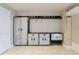 Basement features wall cabinets, a beverage cooler, and a countertop at 140 Brightwater Dr # 6, Clearwater Beach, FL 33767