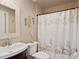 Clean bathroom with shower/tub combo, seashell decor, and updated fixtures at 140 Brightwater Dr # 6, Clearwater Beach, FL 33767