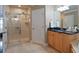 Large bathroom with walk-in shower, granite countertops, and a soaking tub at 140 Brightwater Dr # 6, Clearwater Beach, FL 33767