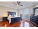 Main bedroom with water views and dark wood furniture at 140 Brightwater Dr # 6, Clearwater Beach, FL 33767