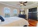 Main bedroom with large windows, hardwood floors, and a walk-in closet at 140 Brightwater Dr # 6, Clearwater Beach, FL 33767