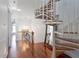 Hallway with spiral staircase and hardwood floors at 140 Brightwater Dr # 6, Clearwater Beach, FL 33767