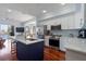 Modern kitchen with stainless steel appliances and a large island at 140 Brightwater Dr # 6, Clearwater Beach, FL 33767