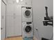 Laundry room with washer, dryer, and cabinets at 140 Brightwater Dr # 6, Clearwater Beach, FL 33767