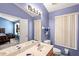 Double vanity bathroom with a large mirror at 3010 Bayshore Pointe Dr, Tampa, FL 33611