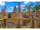 Wooden deck overlooking a pond and lush trees, great for relaxing at 3010 Bayshore Pointe Dr, Tampa, FL 33611