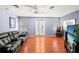 Game room with leather couch, large TV, and access to balcony at 3010 Bayshore Pointe Dr, Tampa, FL 33611
