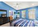 Main bedroom with ensuite bathroom and large TV at 3010 Bayshore Pointe Dr, Tampa, FL 33611