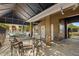 Covered patio with seating and a view of the pool at 3010 Bayshore Pointe Dr, Tampa, FL 33611