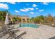Community pool with lounge chairs and patio area at 3010 Bayshore Pointe Dr, Tampa, FL 33611