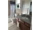 Bathroom with granite countertop, tub and shower at 844 Callista Cay Loop, Tarpon Springs, FL 34689