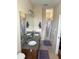 Double vanity bathroom with shower and granite counters at 844 Callista Cay Loop, Tarpon Springs, FL 34689