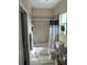 Clean bathroom with tub, shower, toilet and granite vanity at 844 Callista Cay Loop, Tarpon Springs, FL 34689