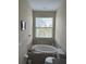 Oval bathtub, toilet, and window with blinds in a spacious bathroom at 844 Callista Cay Loop, Tarpon Springs, FL 34689