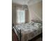Bedroom with queen bed and window at 844 Callista Cay Loop, Tarpon Springs, FL 34689