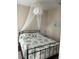 Bedroom with queen bed and canopy at 844 Callista Cay Loop, Tarpon Springs, FL 34689