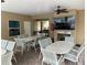 Community room with fireplace, TV, and seating for gatherings at 844 Callista Cay Loop, Tarpon Springs, FL 34689