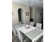 Elegant dining room with a large table and statement lighting at 844 Callista Cay Loop, Tarpon Springs, FL 34689