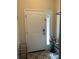 Interior entryway with white door and tile flooring at 844 Callista Cay Loop, Tarpon Springs, FL 34689