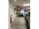 Garage with overhead storage, workbench, and room for a vehicle at 844 Callista Cay Loop, Tarpon Springs, FL 34689