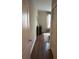 Hallway with dark brown wood flooring at 844 Callista Cay Loop, Tarpon Springs, FL 34689