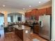 Modern kitchen with stainless steel appliances and an island at 844 Callista Cay Loop, Tarpon Springs, FL 34689
