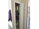 Bathroom linen closet with shelving, neatly organized with towels and toilet paper at 844 Callista Cay Loop, Tarpon Springs, FL 34689