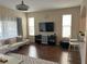 Bright living room featuring hardwood floors and comfy furniture at 844 Callista Cay Loop, Tarpon Springs, FL 34689