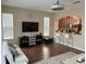 Open living room with kitchen views and breakfast bar at 844 Callista Cay Loop, Tarpon Springs, FL 34689