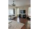Living room with hardwood floors and modern furniture at 844 Callista Cay Loop, Tarpon Springs, FL 34689