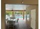 Covered patio with table and chairs, overlooking the pool at 844 Callista Cay Loop, Tarpon Springs, FL 34689