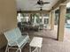 Covered patio with seating and ceiling fans, perfect for relaxing at 844 Callista Cay Loop, Tarpon Springs, FL 34689