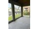 Screened-in porch overlooking canal with boat slips at 844 Callista Cay Loop, Tarpon Springs, FL 34689