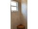 Beige tiled shower with corner bench and window at 844 Callista Cay Loop, Tarpon Springs, FL 34689