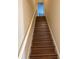 Wooden staircase leading to the upper level at 844 Callista Cay Loop, Tarpon Springs, FL 34689